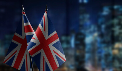 Small flags of the United Kingdom on an abstract blurry background
