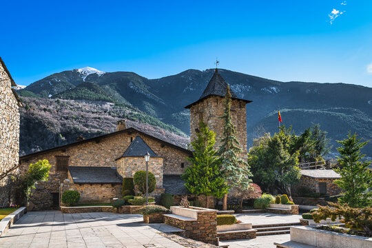 Old, 15th century stone government heritage building, Casa de la Vall, with tower and surrounding garden, Andorra la Vella, Pyrenees Mountains