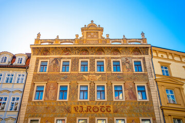 Prague, Czech Republic – May 7, 2018: Colorful ancient houses and sculptures at old historical and touristic downtown in Prague, details, closeup. Cityscape of Medieval Prague