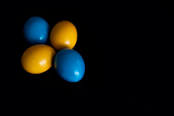 Easter eggs in blue and yellow colors of the flag of Ukraine. Stop war in Ukraine concept.