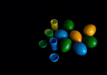 Easter eggs in nest painted by hand in blue color on dark background. Chicken and quail eggs catholic and orthodox easter holiday