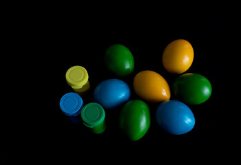 Easter eggs in nest painted by hand in blue color on dark background. Chicken and quail eggs catholic and orthodox easter holiday