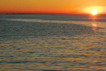Fototapeta na wymiar The sun sets over the Mozambique capital city of Maputo as seen from Inhaca Island.