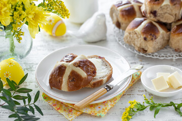 Traditional Easter hot cross buns with butter - 565899543