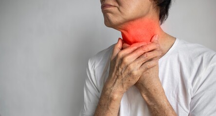 Redness at neck of Asian man. Concept of sore throat, pharyngitis, laryngitis, thyroiditis, choking...