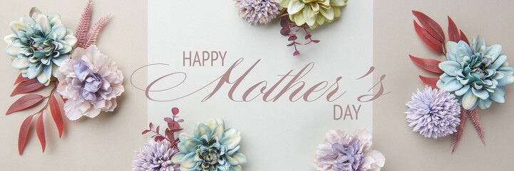 Happy Mother's Day Pastel Colored and Muted Earthy Tones Banner. Flat lay floral greeting card with beautiful silk flowers.
