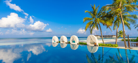Beachside tourism panoramic landscape. Luxurious beach resort poolside, swimming pool, beach chairs...