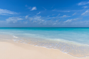 Freedom beach. Closeup white sand, calm blue sea, sunny sky. Seascape horizon. Beautiful outdoor nature scenic, tropical Mediterranean ocean shore. Beautiful tranquil coastline, relax island paradise.