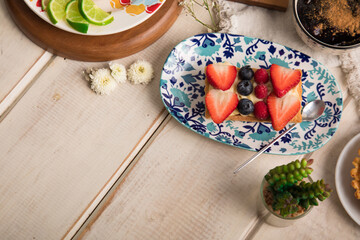 Strawberry and blueberry tartlet  Assorted peruvian desserts peru sweet food buffet table brunch
