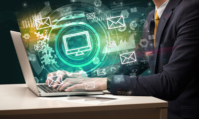 Business hand typing on a modern laptop