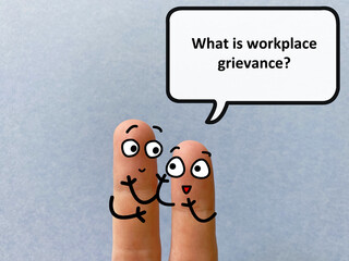 Two fingers are decorated as two person. One of them is asking another what is workplace grievance.