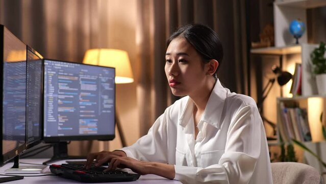 Asian Woman Programmer Yawning While Creating Innovative Software Engineer Developing App, Program, Video Game On Desktop Computer At Home. Terminal With Coding Language 

