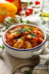 Vegetable dish of beans, peppers and tomatoes sprinkled with fresh parsley. Vegan stew with vegetables