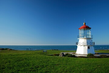 Shelter Cove lighthouse facing the ocean under a clear blue sky, California, USA
