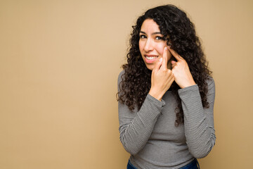 Upset young woman with acne problems