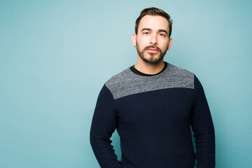 Serious somber caucasian man looking at the camera