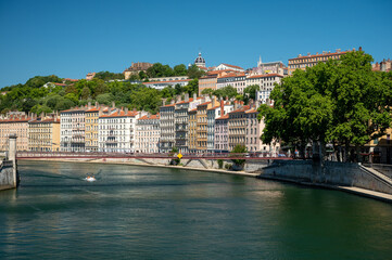 Tourist destination, views of Rhone river, streets, houses, cafes in old central part of Lyon in summer, France