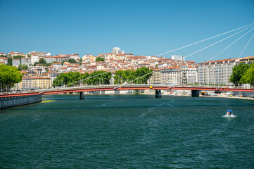 Tourist destination, views of Rhone river, streets, houses, cafes in old central part of Lyon in summer, France