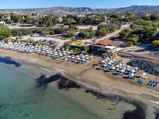 Fototapeta na wymiar Aerial view on clear blue water of Coral bay in Peyia, Mediterranean sea near Paphos, Cyprus, Coral beach