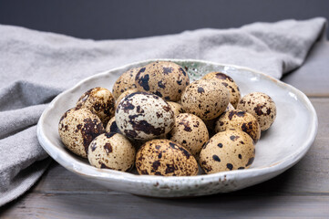 Fresh small spotted partridge or quail bird eggs