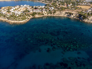 Aerial view on clear blue water of Coral bay in Peyia, Mediterranean sea near Paphos, Cyprus, Coral beach