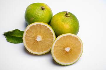 Fresh ripe bergamot orange fruits, fragrant citrus used in earl grey tea, medicine and spa treatments on white background isolated