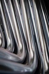 Close up of Exhaust Pipes. Industrial background. Galvanized metal tubes – Pipes with zinc plated coating. Abstract background view of steel light blue galvanized pipes. Construction metal pipes.