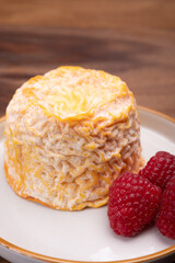French Langres soft cows crumbly cheese with washed rind structure made in Champagne - Ardenne...