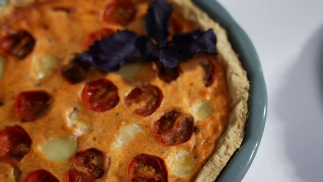 Tasty homemade pie with tomatoes and cabbage on table, closeup. Cottage cheese tart with cherry tomatoes