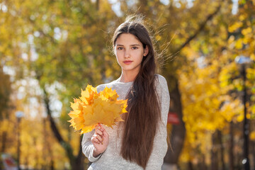 Portrait of a young beautiful girl, autumn outdoor