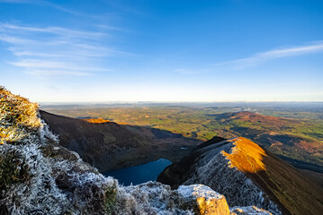 Picturesque Irish landscape with Coumshingaun Lough lake surrounded by Comeragh Mountains in County...