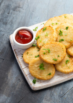 Healthy Cauliflower Hash Browns On White Wooden Board