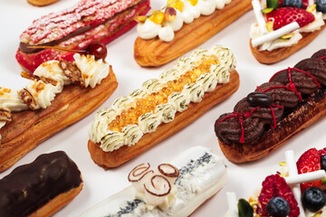 Éclairs with delicate piped cream and vibrant fruit garnishes, each piece displaying the skill of a fine patissier