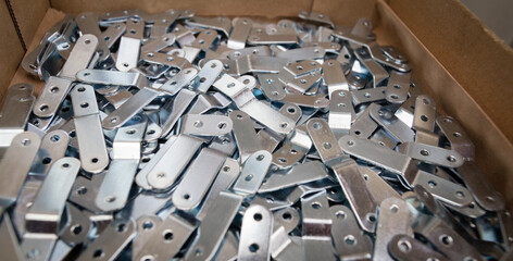 Stamping plates of complex shape ready for assembly part, made of steel on CNC machines, presses....