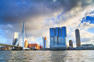 Cityscape of Rotterdam - view of the Erasmus Bridge and Tower blocks in the Kop van Zuid neighbourhood, South Holland, The Netherlands