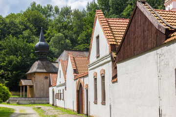 White houses and wooden church in Nowy Sacz, Poland