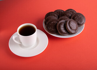 photo coffee mug and chocolate-covered round cookies