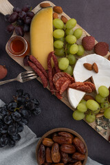 appetizer and cheese board, tapas with meat and fruits