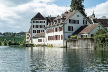 Fototapeta na wymiar Gebäude des ehemaligen Klosters Rheinau am Fluss Rhein, Kanton Zürich, Schweiz