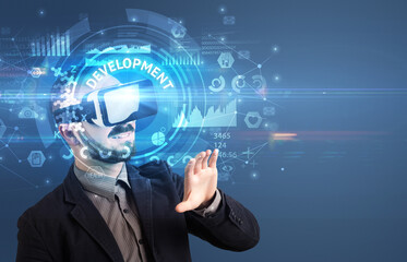Businessman looking through VR glasses