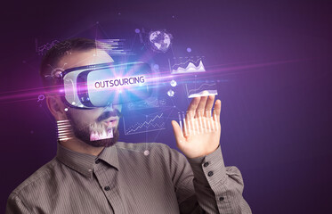 Businessman looking through Virtual Reality glasses