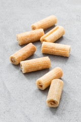 Vegan sweet waffle rolls. Light grey background