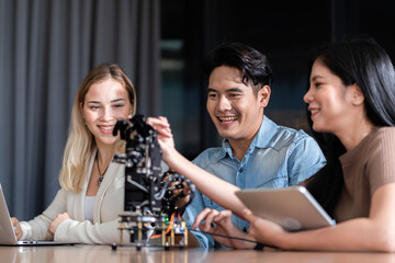 Young students researching inventions with modern technology in university libraries.
