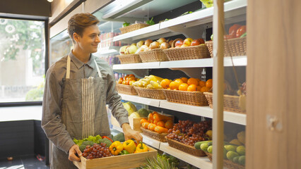 Portrait of a caucasian man working in a supermarket or retail shop and food on grocery products. Food shopping. People lifestyle. Business service. A staff worker