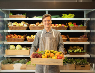 Portrait of a caucasian man working in a supermarket or retail shop and food on grocery products. Food shopping. People lifestyle. Business service. A staff worker