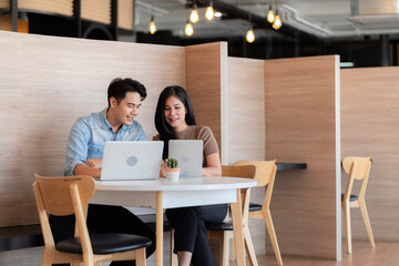 Young students researching inventions with modern technology in university libraries.