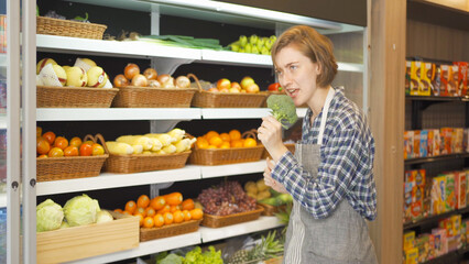 Portrait of a caucasian woman working in a supermarket or retail shop and food on grocery products. Food shopping. People lifestyle. Business service. A staff worker