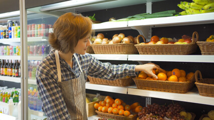 Portrait of a caucasian woman working in a supermarket or retail shop and food on grocery products. Food shopping. People lifestyle. Business service. A staff worker