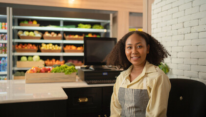 Fototapeta na wymiar Portrait of a black african american woman working on cashier in a supermarket or retail shop and food on grocery products. Food shopping. People lifestyle. Checkout business counter service. Worker
