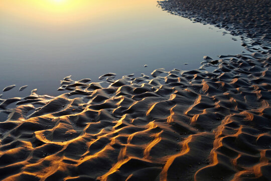 Sands flats exposed at low tide at West Wittering, West Sussex, UK.